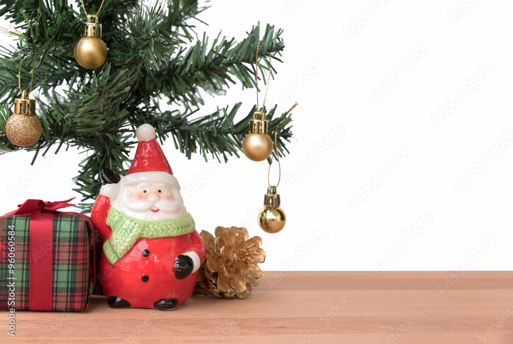 Santa claus with the gift and christmas tree