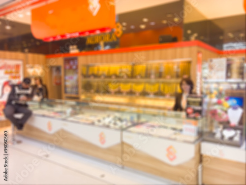 Blurred gold shop with Security Police in big moderntrade mall