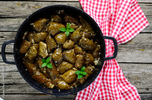 Dolma ,greek traditional appetizer in the crock-pot.selective focus