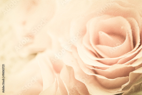 roses flowers in vintage color style on mulberry paper texture for romantic background 