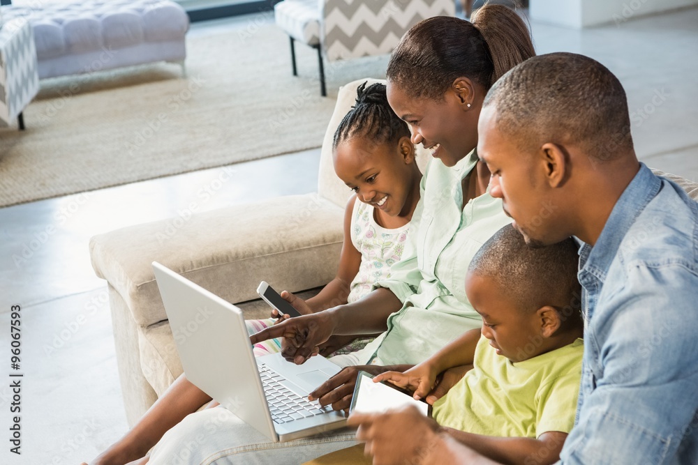 Happy family using technology together Happy family using technology together