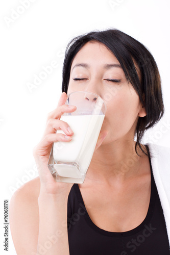 beautiful sport woman drinking milk