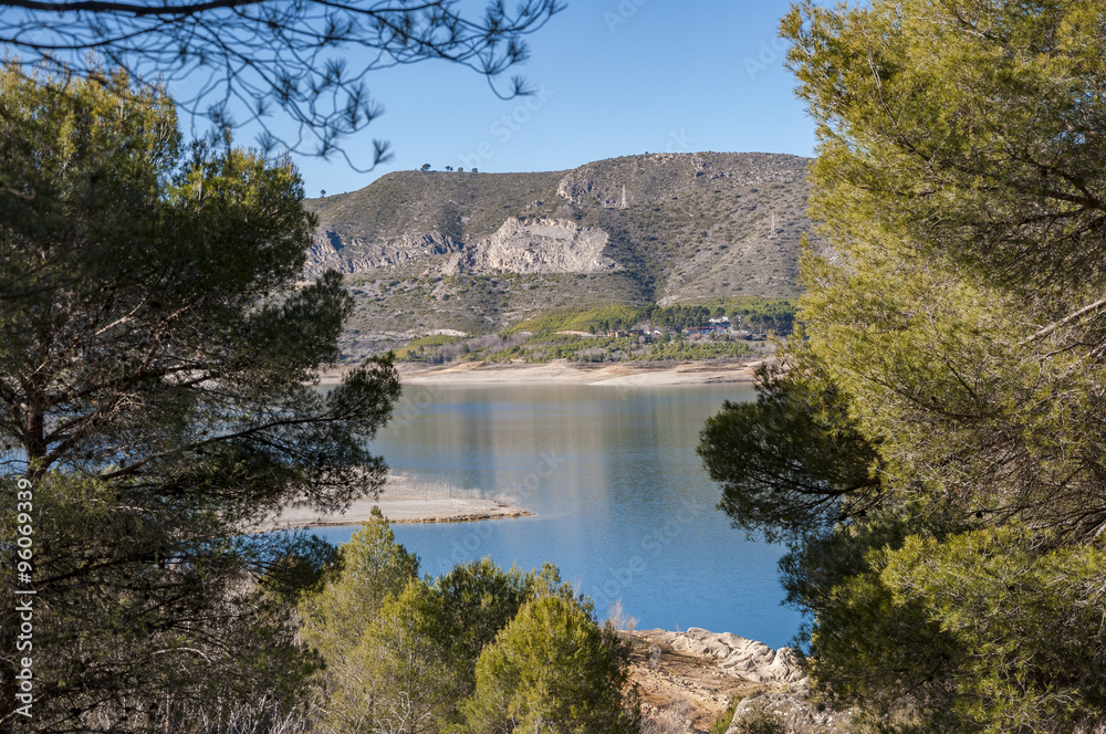 Views of Buendia Reservoir, in the upper waters of the river Tagus, Cuenca, Castilla La Mancha, Spain. The surface area of the reservoir measures 8,194 hectares
