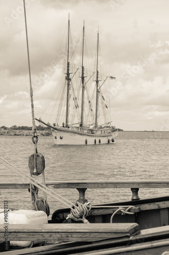 Old sailboat in the harbor, sepia