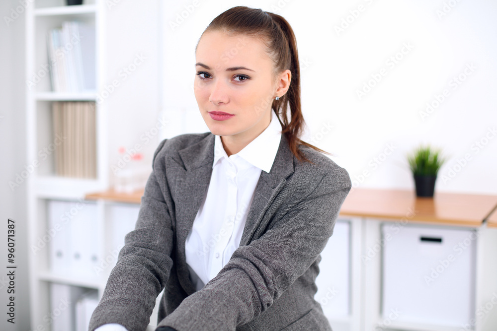 Young business woman in office. Successful business concept. Young business woman in office. Successful business concept.