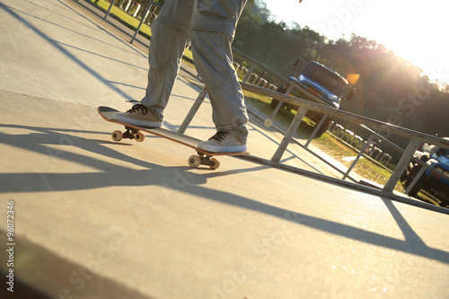 skateboarder riding on skateboard at skatepark ramp