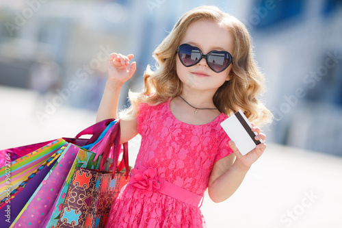 A young buyer with colored bags and credit card