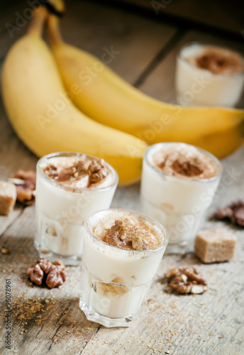 Fresh homemade dessert of bananas, yogurt and nuts, selective fo