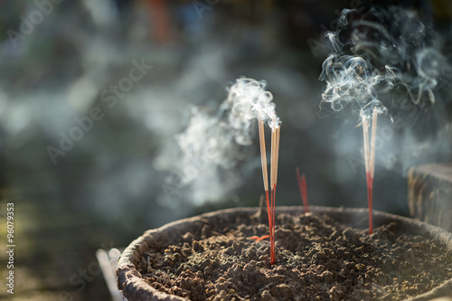 Incense sticks(joss sticks) burning. photo