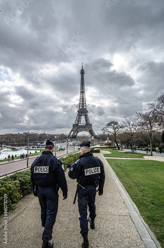 Wallpaper Mural Paris , Paris Security agents guard the Eiffel Tower / Paris, France - March 18, 2012: Patrols of two police officers in the Trocadero gardens and Eiffel Tower. Torontodigital.ca