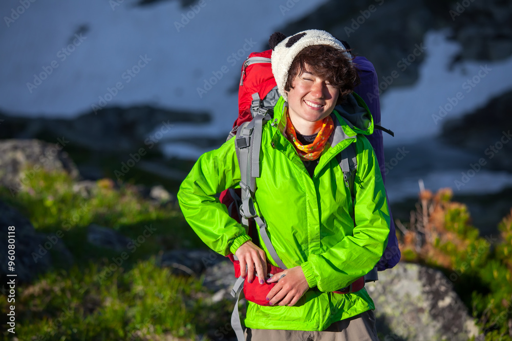 Portrait of young woman hiking in highlands of Altai mountains,