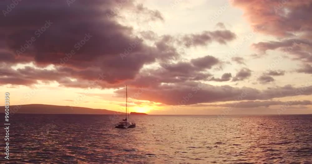 Sailing into the Sunset. Aerial View Flying Over Sail Boat. Shot in 4K. Amazing Vibrant Sunset in Hawaii Sailing into the Sunset. Aerial View Flying Over Sail Boat. Shot in 4K. Amazing Vibrant Sunset in Hawaii
