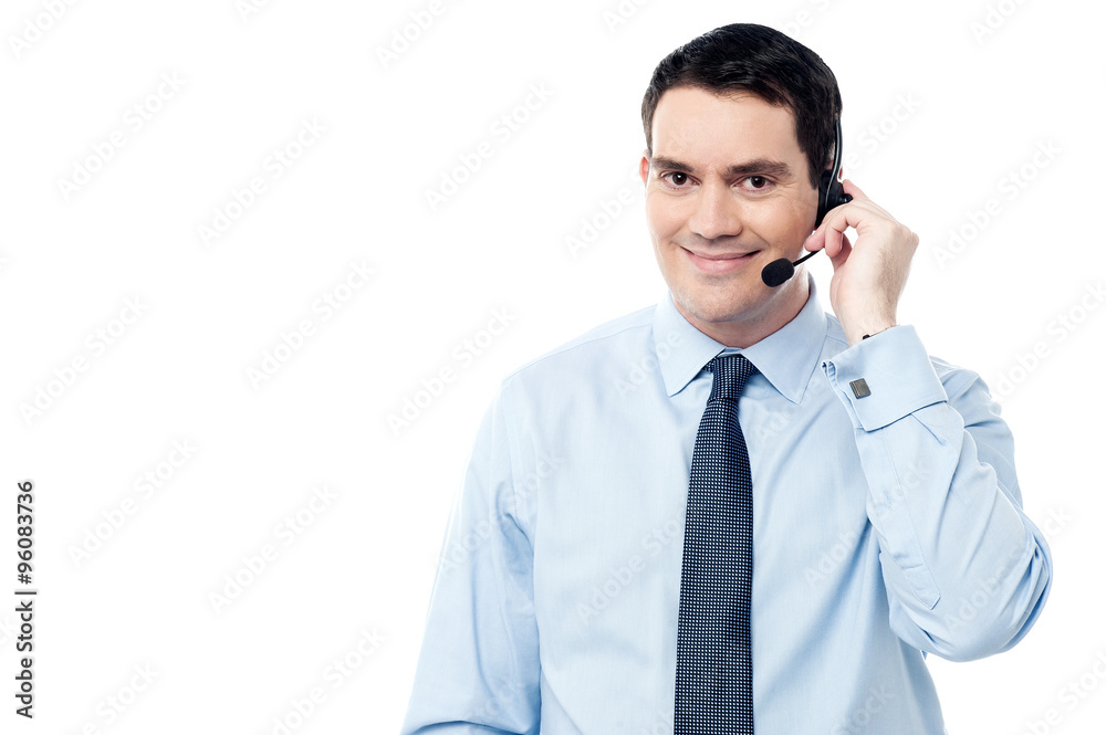 Male employee assisting customer on call Male employee assisting customer on call