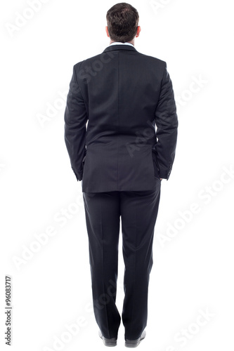 Businessman facing the wall