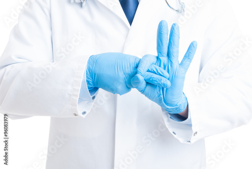 Proctoligist hands making rectal exam gesture
