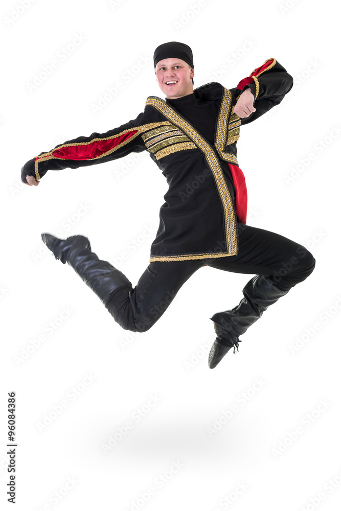young man wearing a folk costume jumping against isolated white with copyspace