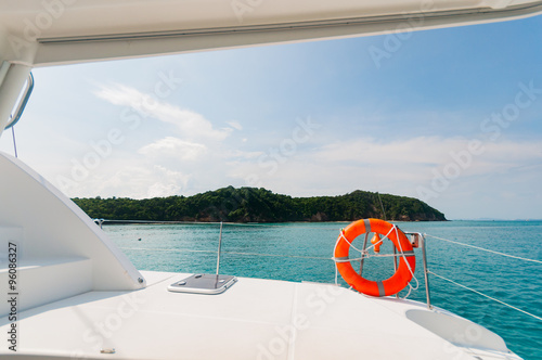 Private catamaran boat floating near  the island. Luxury Lifesty