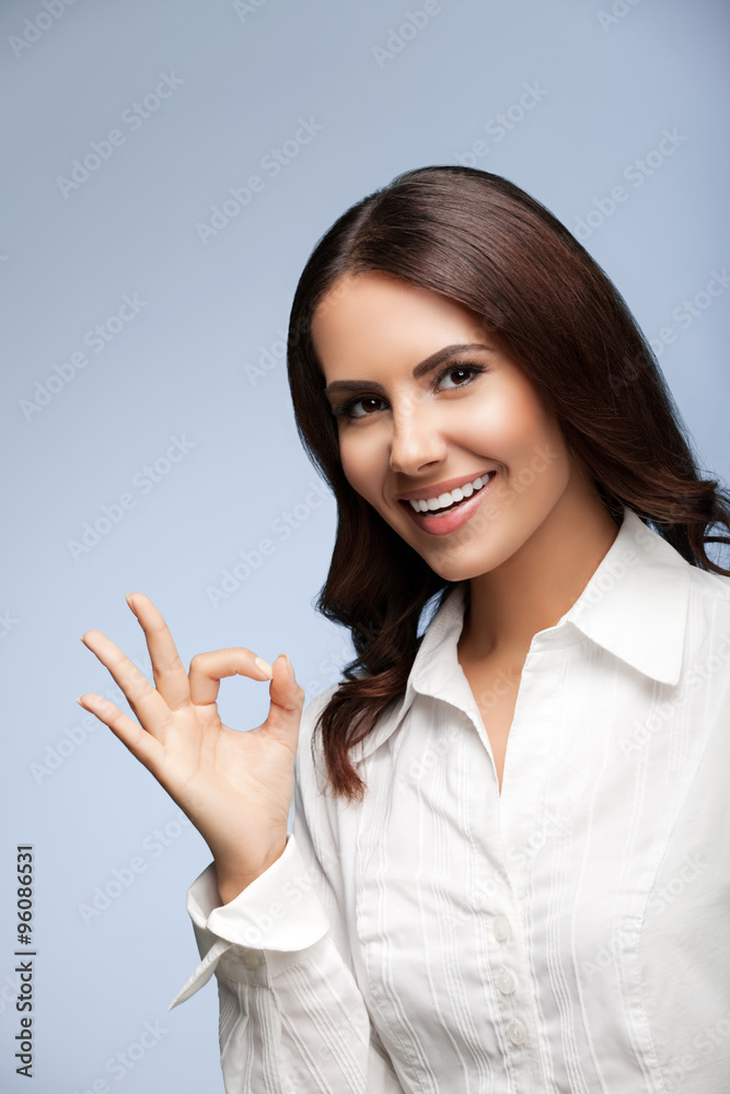 smiling businesswoman, showing okay gesture smiling businesswoman, showing okay gesture