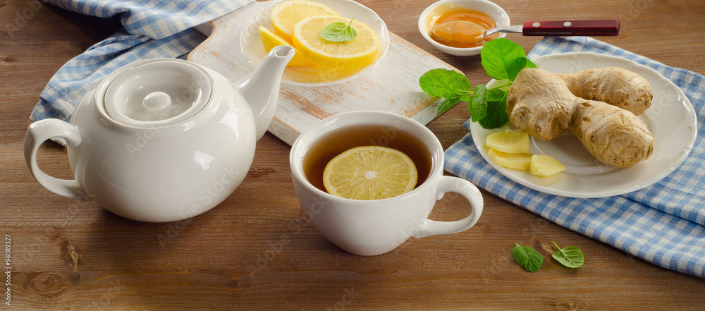 Cup with tea and teapot Cup with tea and teapot