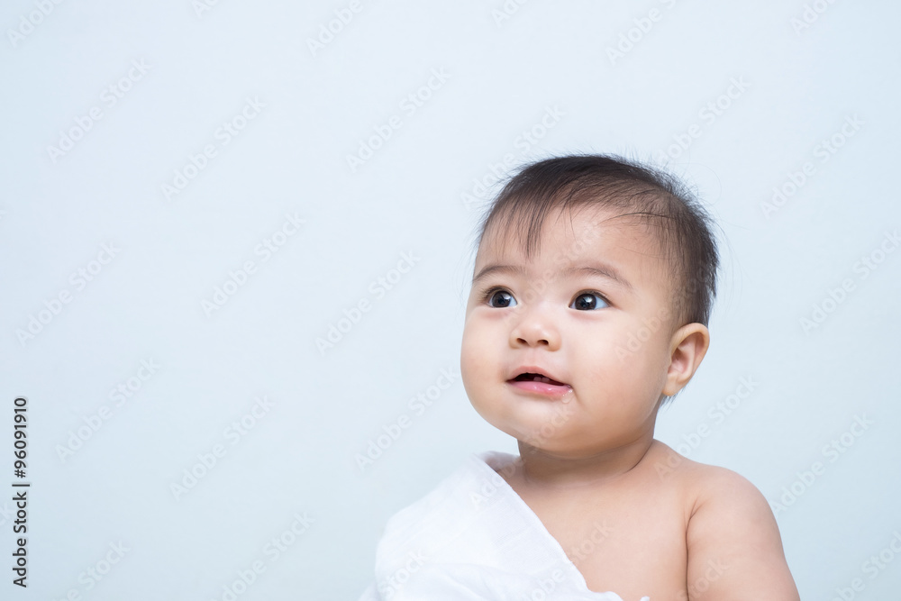 baby girl is playing with the white blanket baby girl is playing with the white blanket
