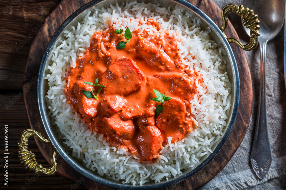 Delicious tikka masala with rice and sauce Delicious tikka masala with rice and sauce