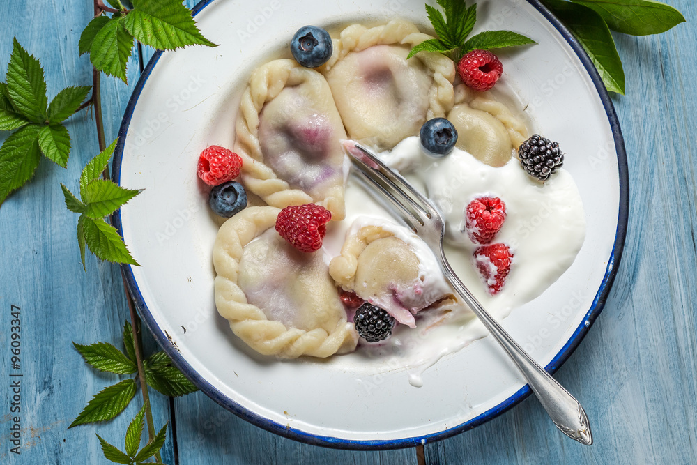 Tasty dumplings with fresh fruits and cream Tasty dumplings with fresh fruits and cream