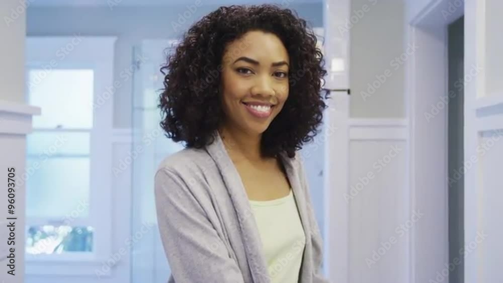 Attractive black woman smiling in bathroom Attractive black woman smiling in bathroom