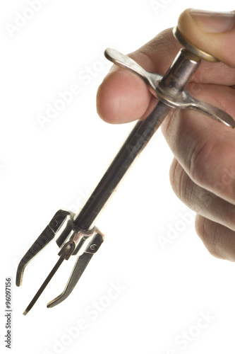 antique olive grabber with hand isolated