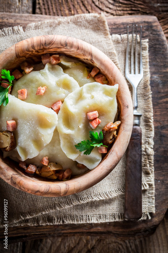 Boiled dumplings with mushrroms and onion photo