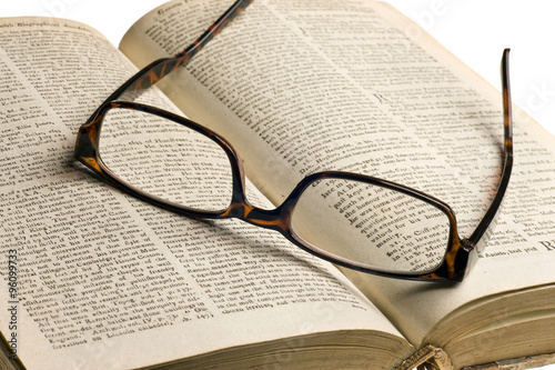 Old book with glasses
