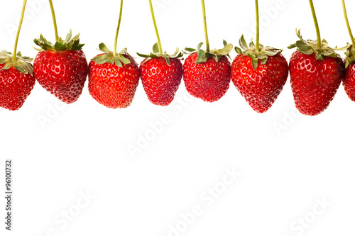 ripe red strawberries with stems and leaves isolated on white ba