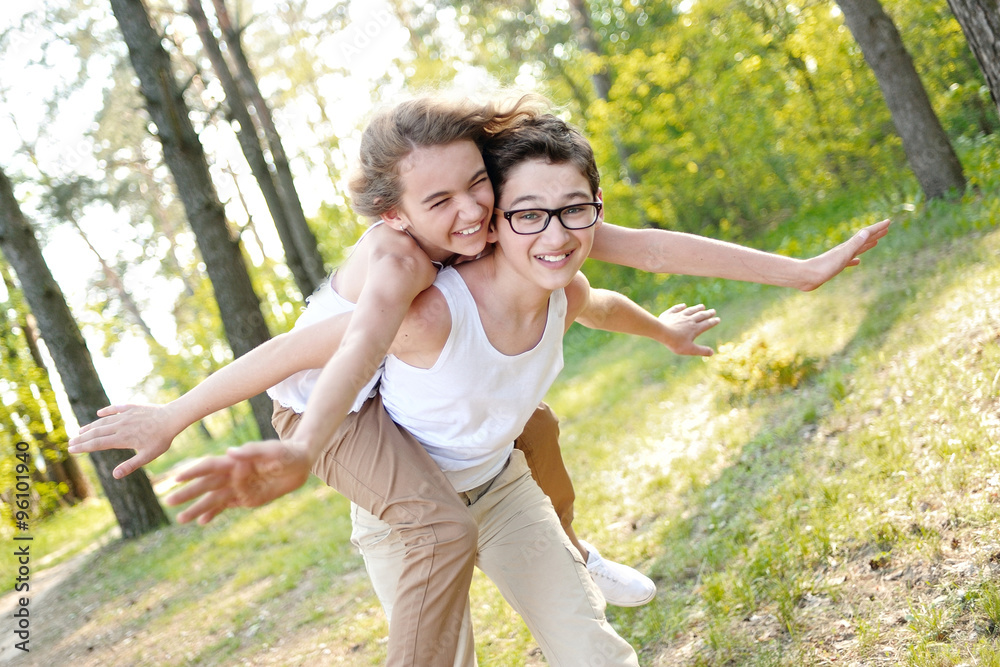 Obraz premium Portrait of a boy and girl in summer