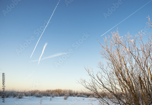 Traces of planes on the winter sky.