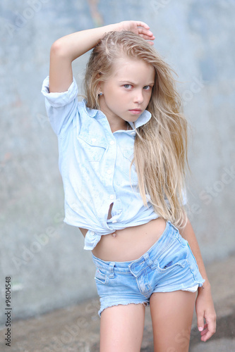 portrait of little girl outdoors in summer