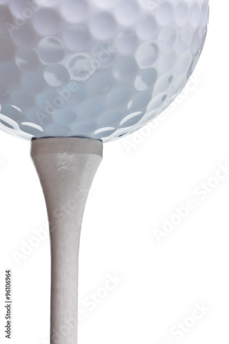 golf ball on tee isolated on white
