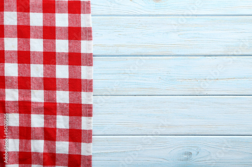 Napkin on blue wooden table, close up