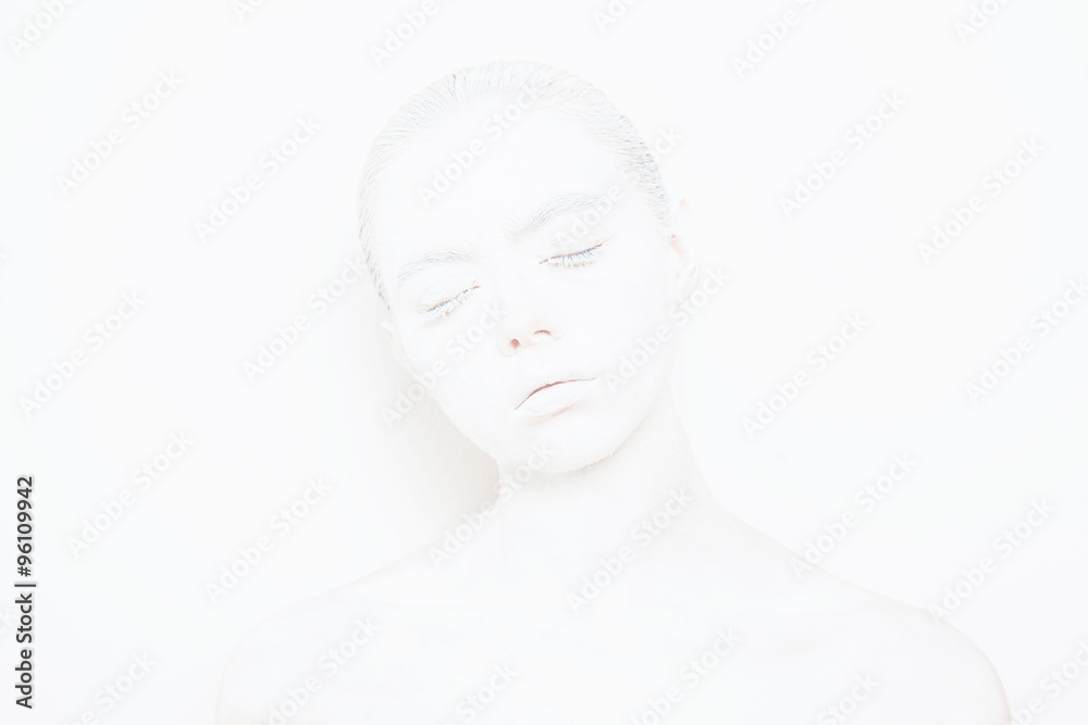 Girl with White Paint on the Skin on a White Background Girl with White Paint on the Skin on a White Background