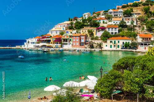 ASSOS TOWN, KEFALONIA ISLAND, GREECE - JULY 12, 2015: Bay and beach of Assos. Assos village on the Island of Kefalonia in Greece photo