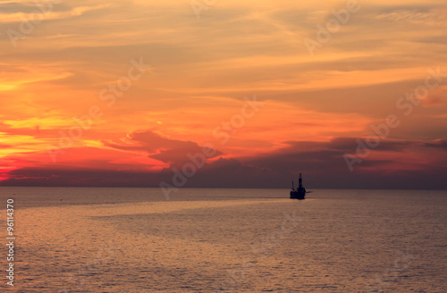 Tender rig,sea,sunset,sky background at gulf of Thailand.
