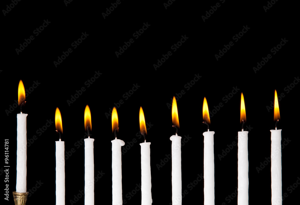 burning hanukkah candles in a menorah burning hanukkah candles in a menorah