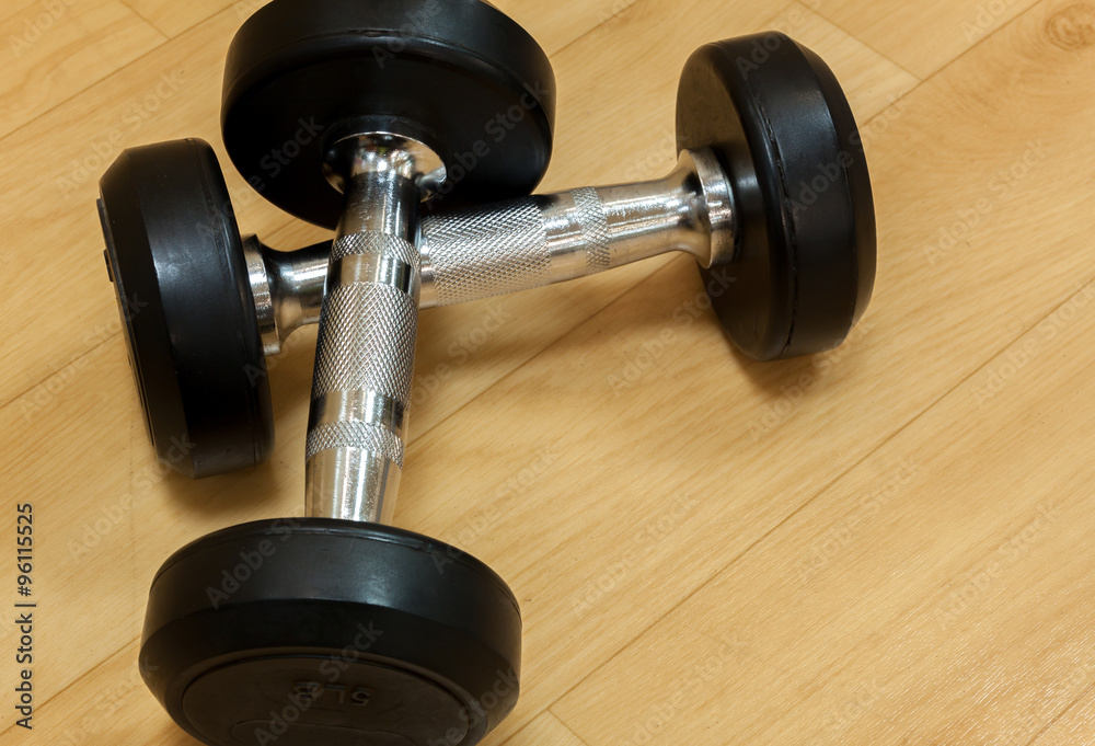 Dumbbells on the wood background. Dumbbells on the wood background.
