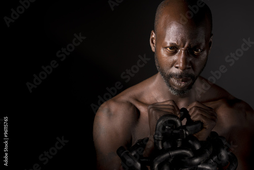 Bare Chested Black Man In Chains photo