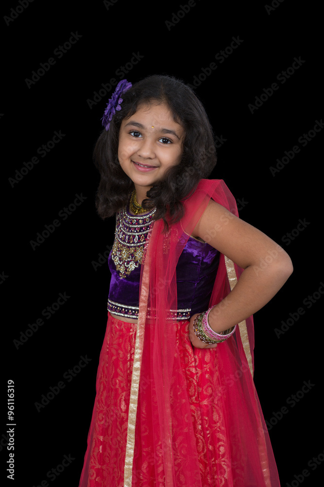 Portrait of a Little Girl in Indian Dance Pose, Isolated, Black Portrait of a Little Girl in Indian Dance Pose, Isolated, Black