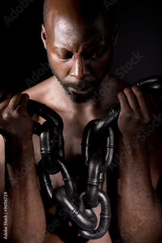Black Man Holding Heavy Chain