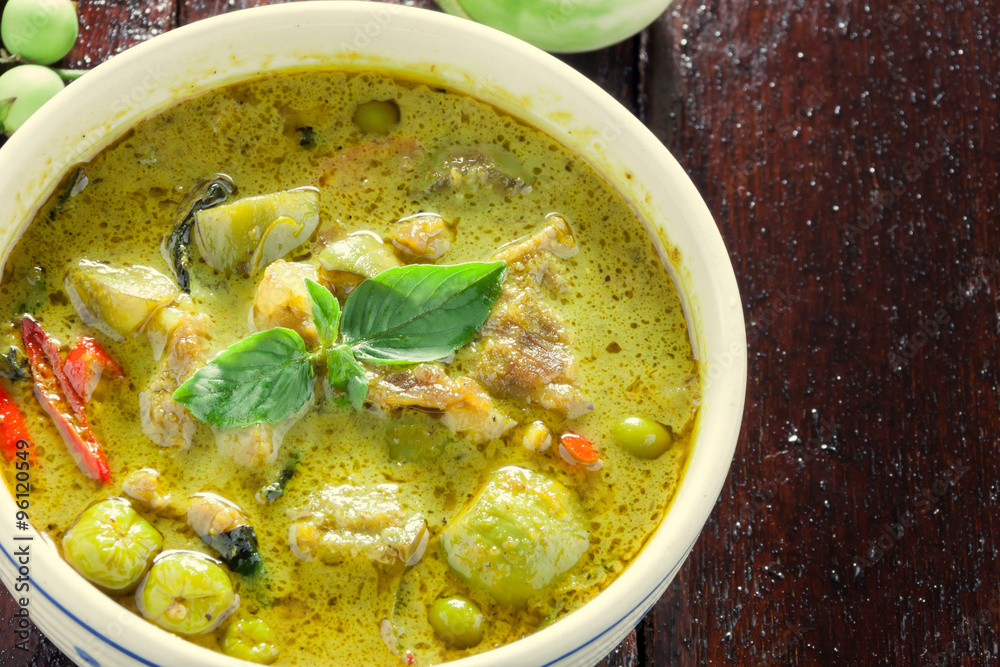 Thai food the pork green curry and eggplant on wood background. Thai food the pork green curry and eggplant on wood background.
