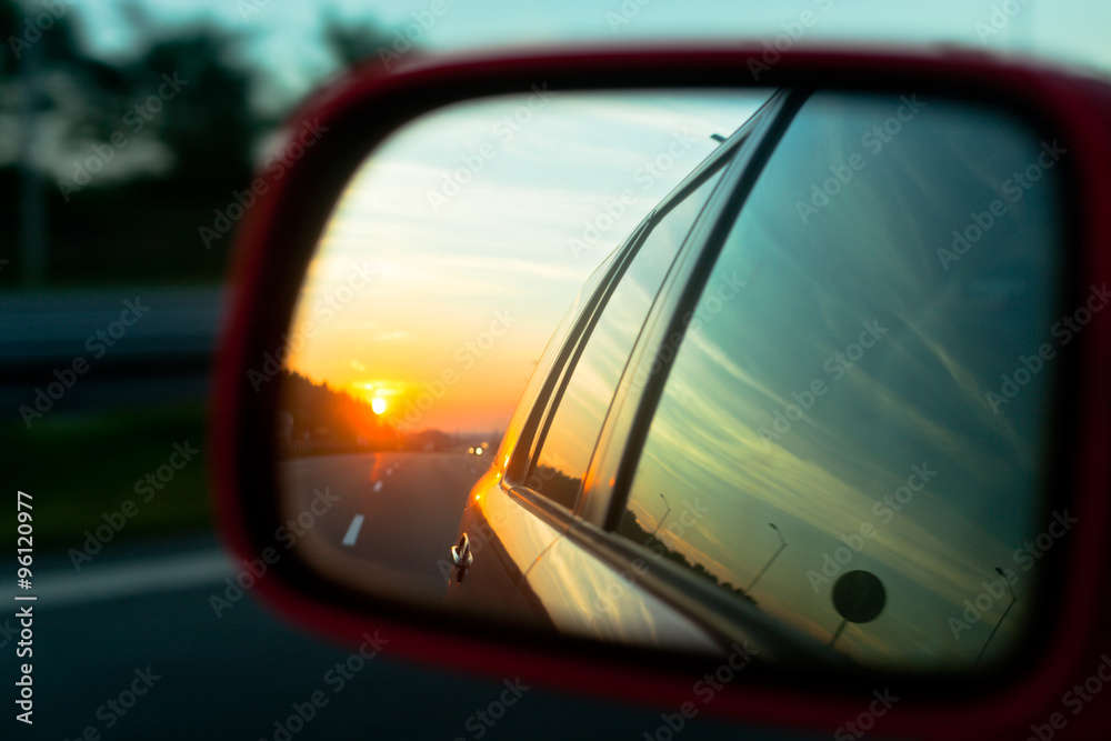 Sunset reflection in the rear view mirror