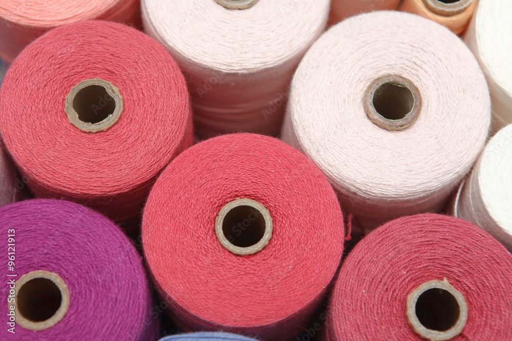 Color sewing threads as a background close up Color sewing threads as a background close up