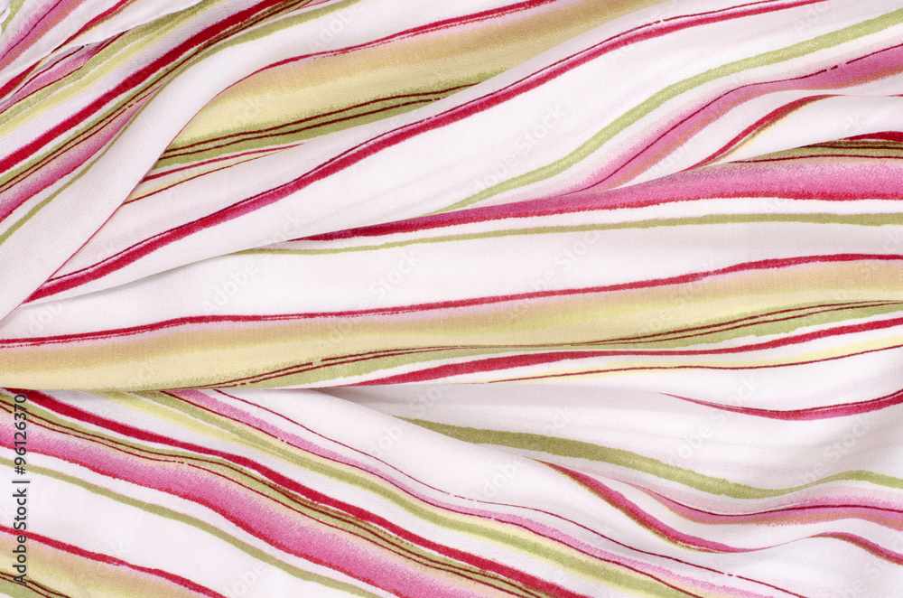 Striped pink, green and white textile pattern as a background. Close up on crumpled material texture fabric. Striped pink, green and white textile pattern as a background. Close up on crumpled material texture fabric.