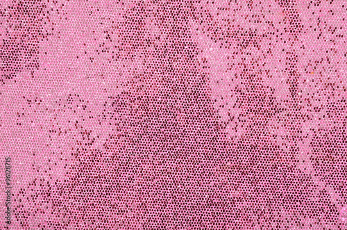 Pink sequins background. Sparkling sequins fabric pattern. photo