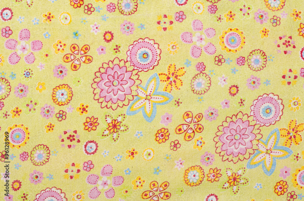 Floral pattern green on fabric. Pink and yellow flowers with blue print as background. Floral pattern green on fabric. Pink and yellow flowers with blue print as background.